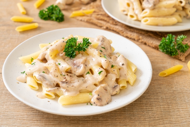 penne pasta carbonara cream sauce with mushroom - Italian food style