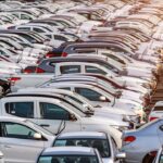 Row of new cars in port.