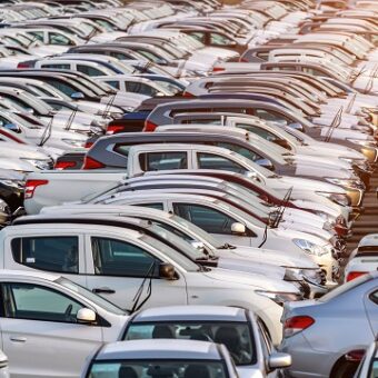 Row of new cars in port.