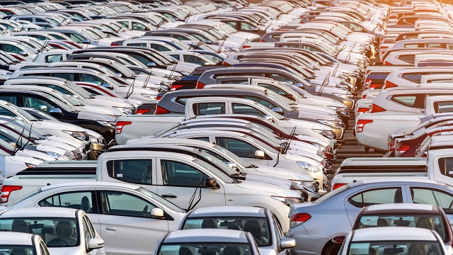 Row of new cars in port.